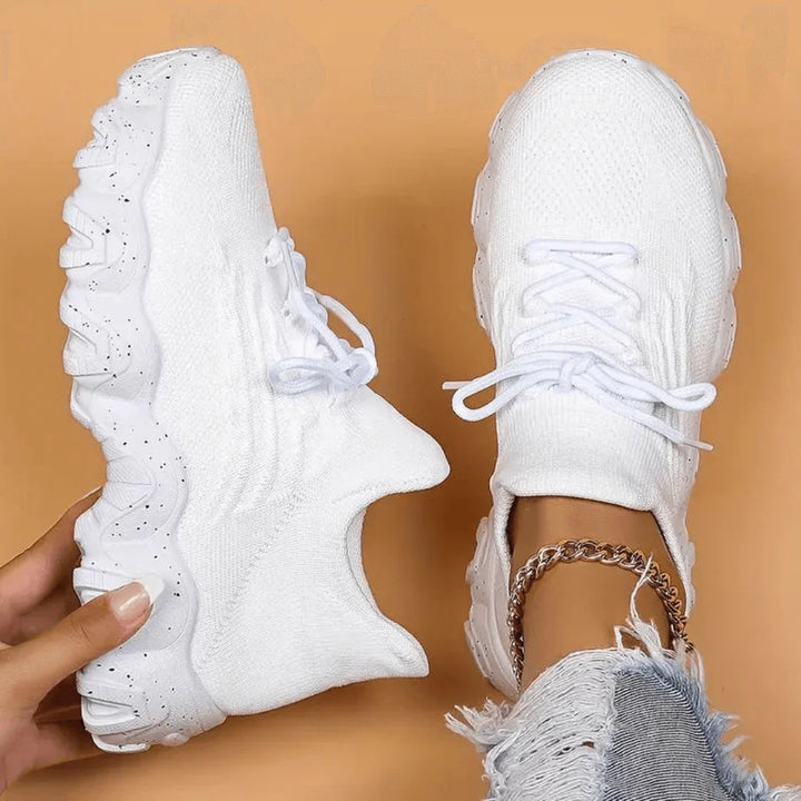 White knit orthopedic high-top sneaker with lace-up front and chunky speckled outsole