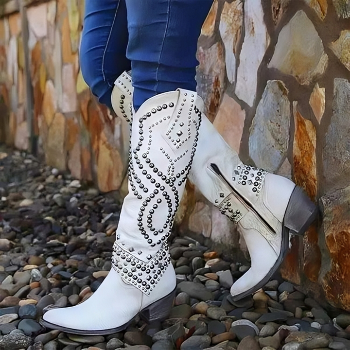 White western knee-high boots with silver stud swirl accents and block heel