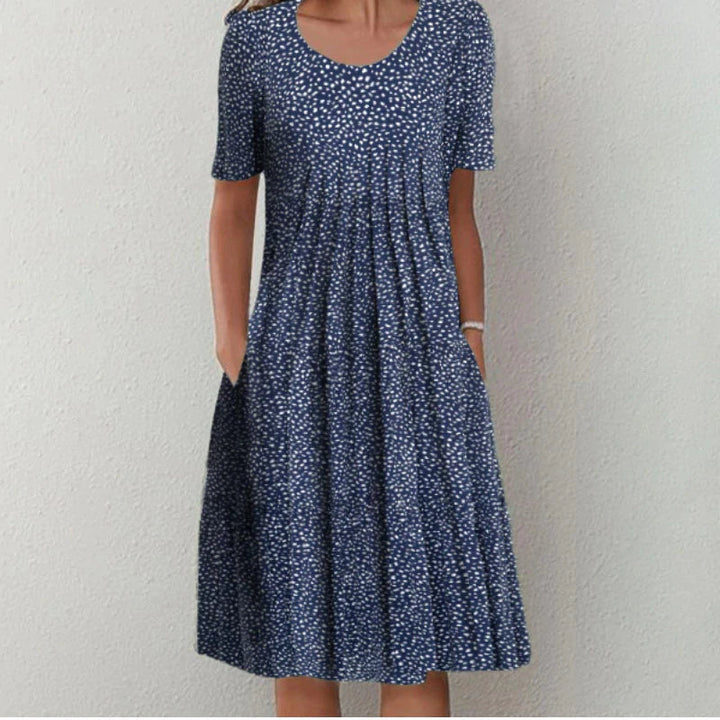Blue dotted tummy control dress with short sleeves, scoop neckline, pleated waist