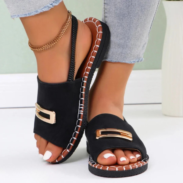 Black comfort sandals with square gold buckle and open toe, stitched platform sole