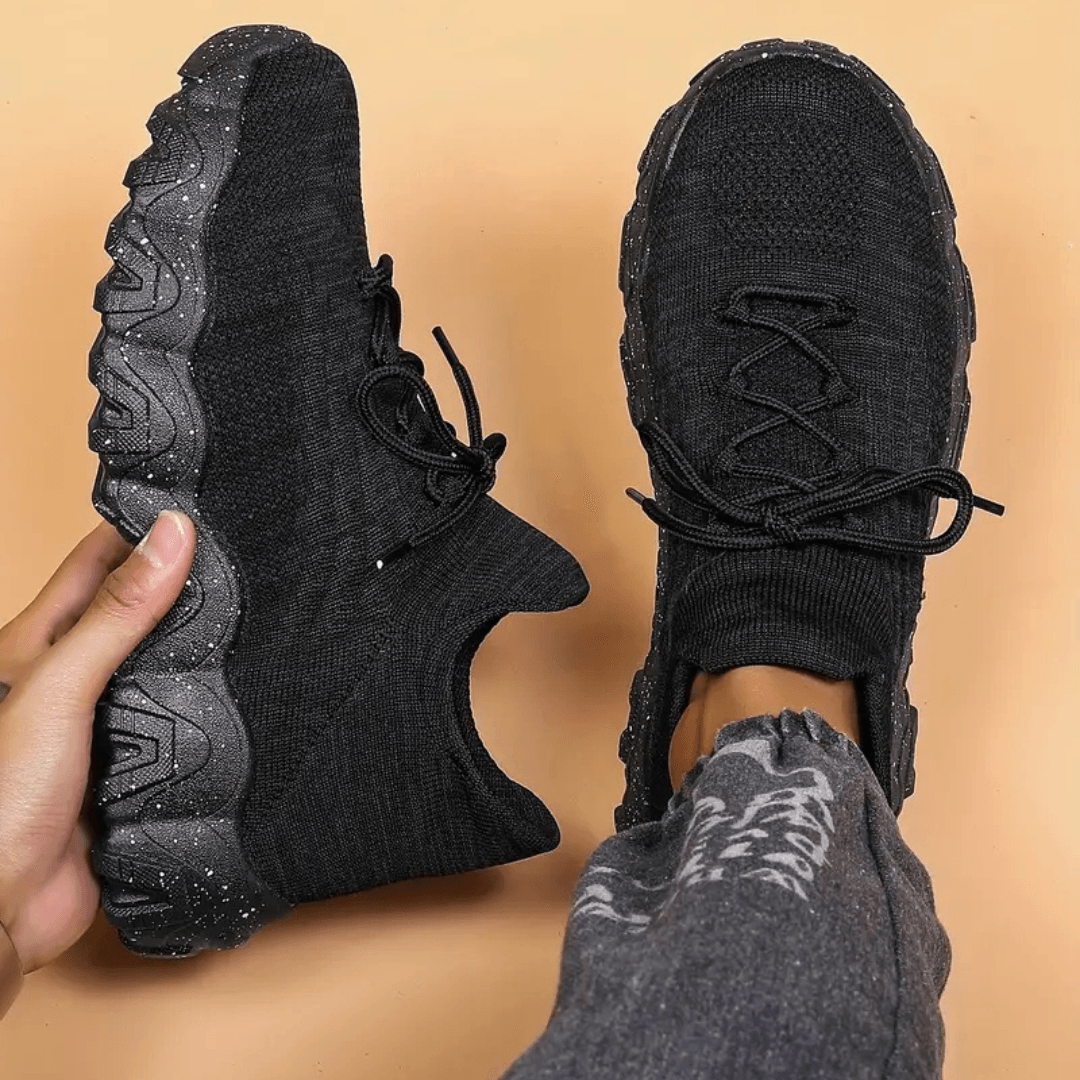Black knit orthopedic high-top sneaker with lace-up front and chunky tread sole