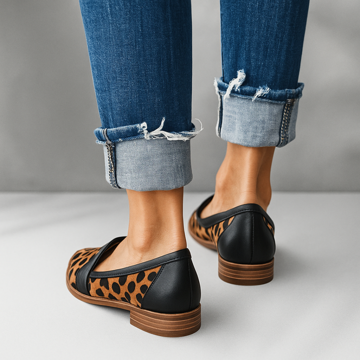 Leopard print pointed slip-on loafer with black back and low stacked sole