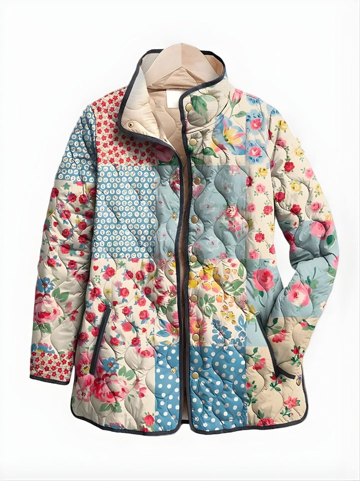 Floral quilted jacket laid flat, multicolor patchwork, front zipper, long sleeves