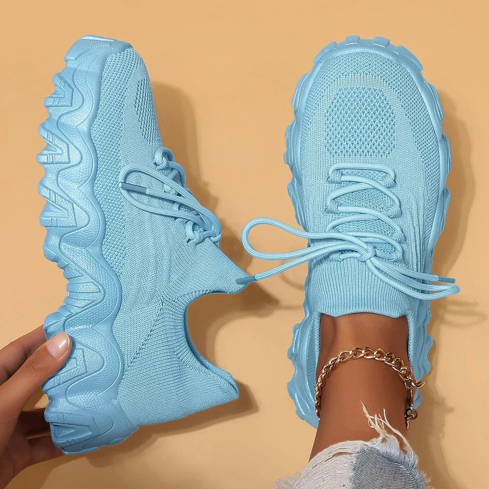 Sky blue knit lace-up sneakers with chunky tread sole, paired front views