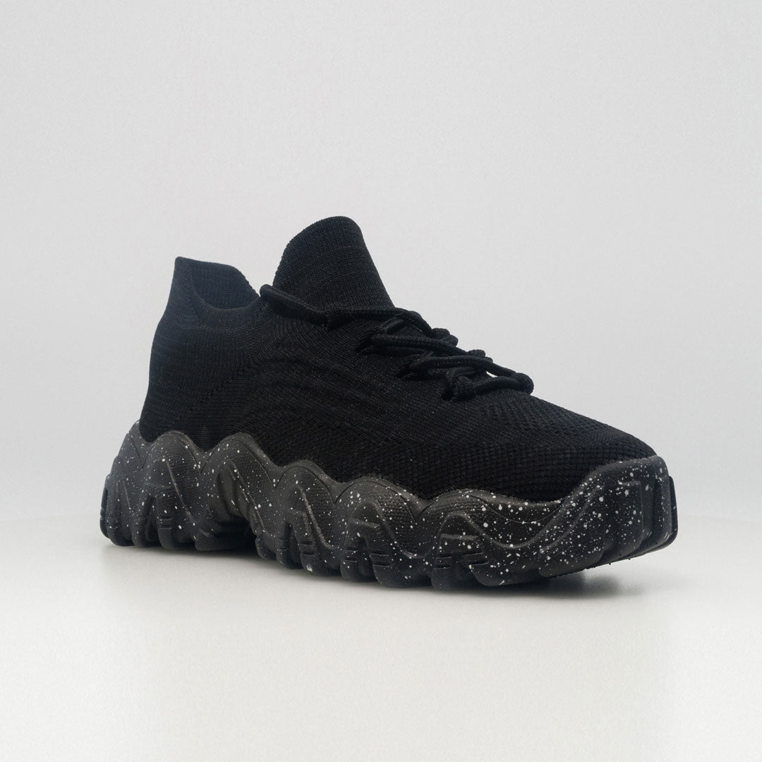 Black lace-up orthopedic sneaker with speckled rubber tread and cushioned sole