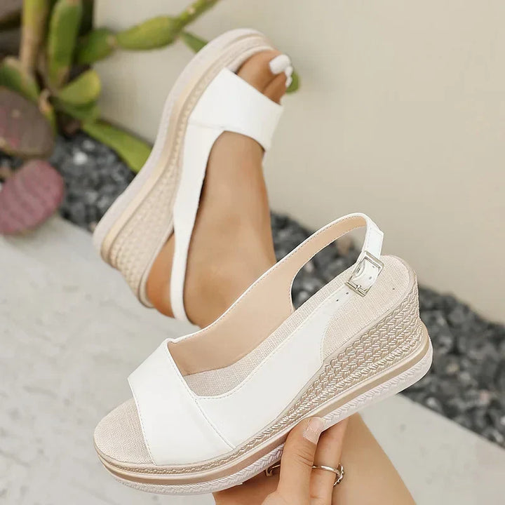 White orthopaedic slingback wedge sandals with adjustable side buckle strap
