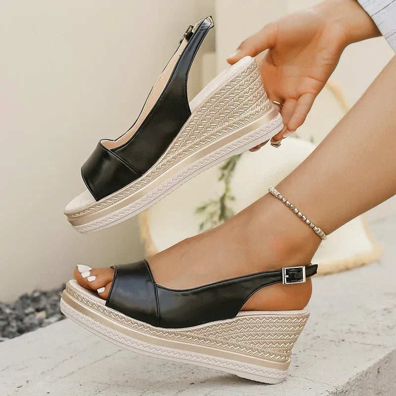 Black orthopaedic slingback wedge sandals with side buckle and textured sole