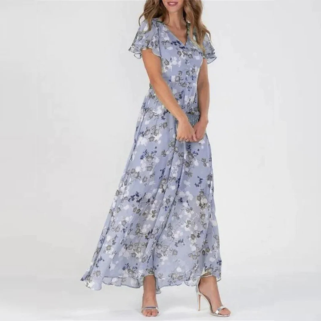Blue floral midi dress with V-neck, short flutter sleeves, and gathered skirt