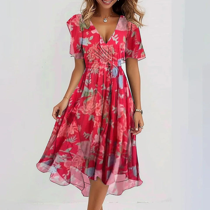 Elegant printed dress in red with pink floral pattern, V-neck and gathered waist