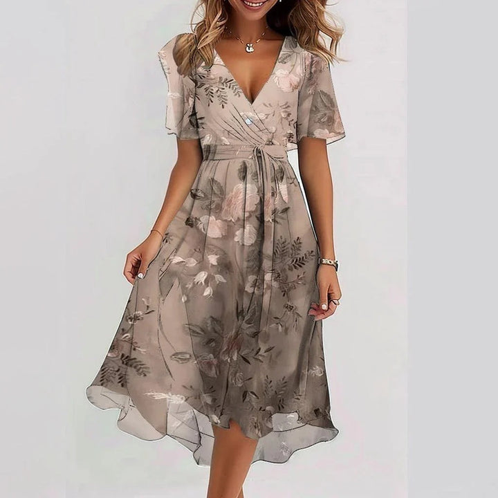 Elegant printed dress in light brown with leaf print, V-neck and tied waist
