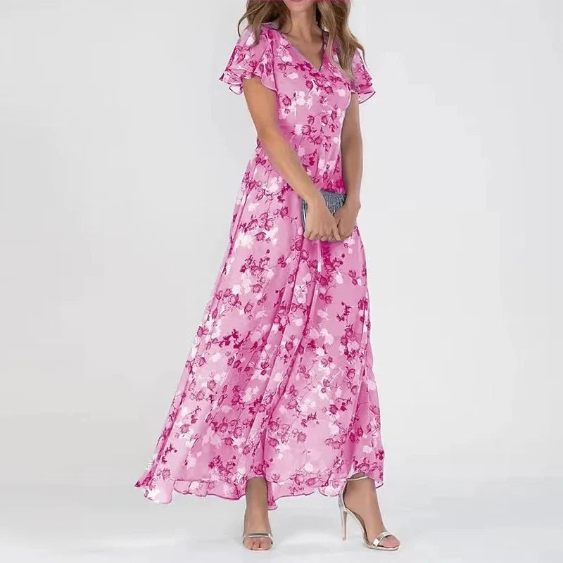 Pink floral midi dress with V-neck, short flutter sleeves, and gathered skirt