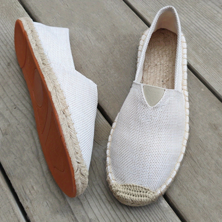 White espadrille slip-on shoe with textured upper and braided jute sole