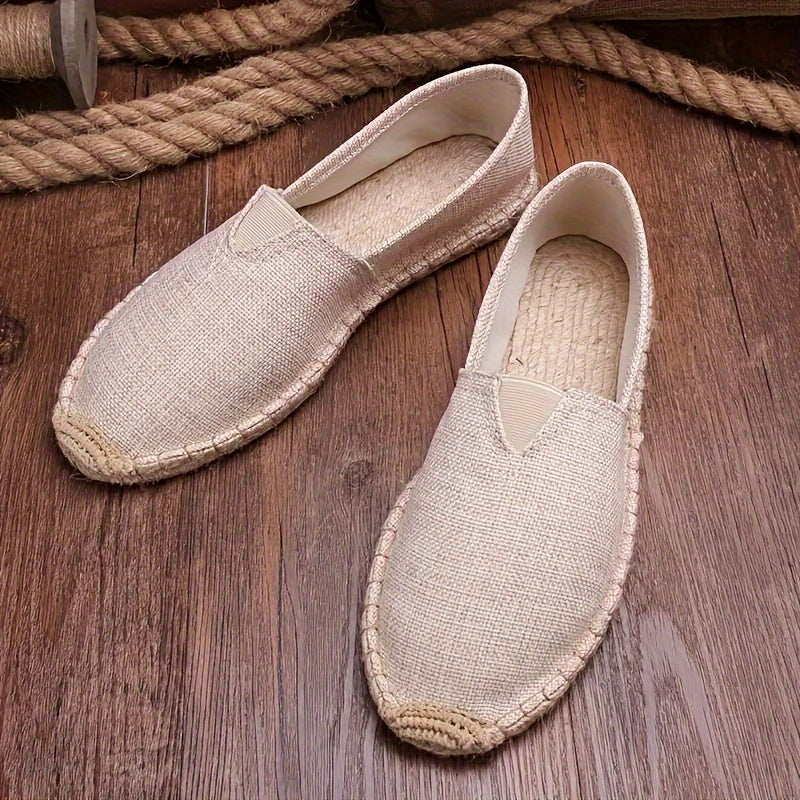 Beige espadrille slip-on with woven jute sole and triangular V-shaped panel