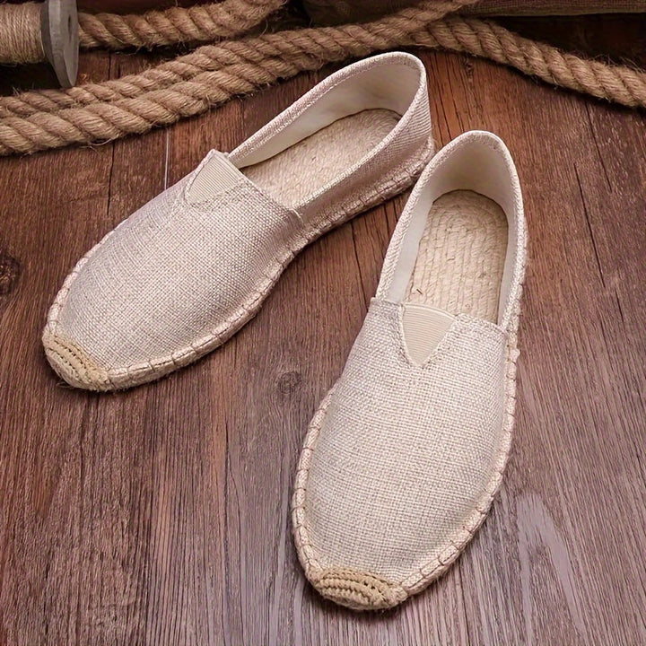Beige espadrille slip-on with woven jute sole and triangular V-shaped panel