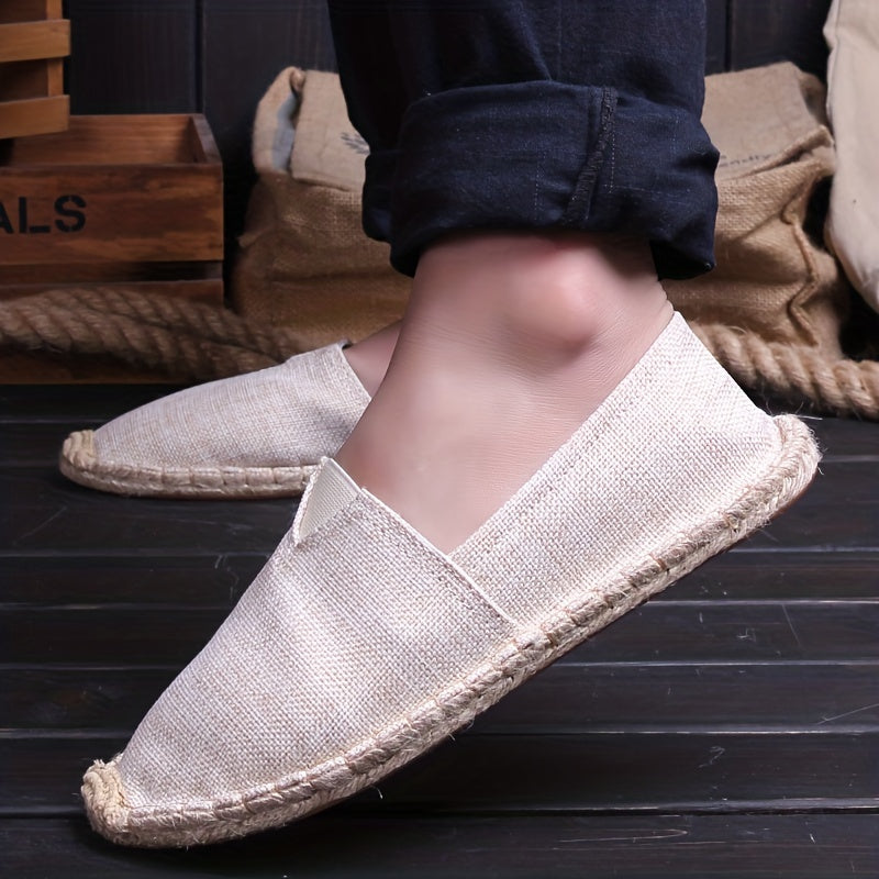 Beige espadrille slip-on with braided jute sole and V-cut vamp on foot