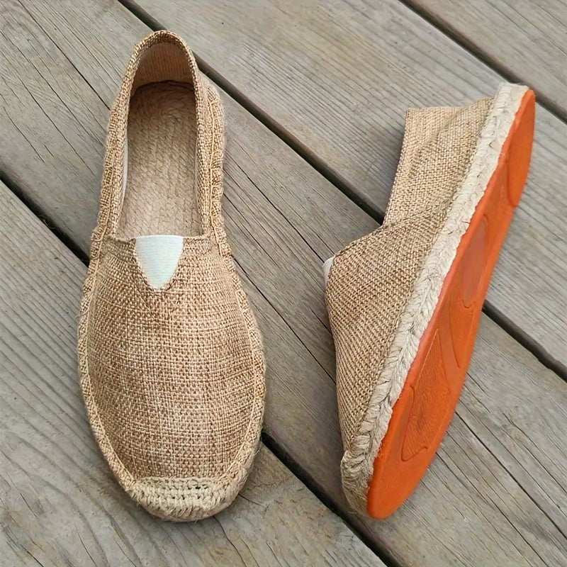 Beige espadrille slip-on with jute sole and peeks of orange rubber outsole