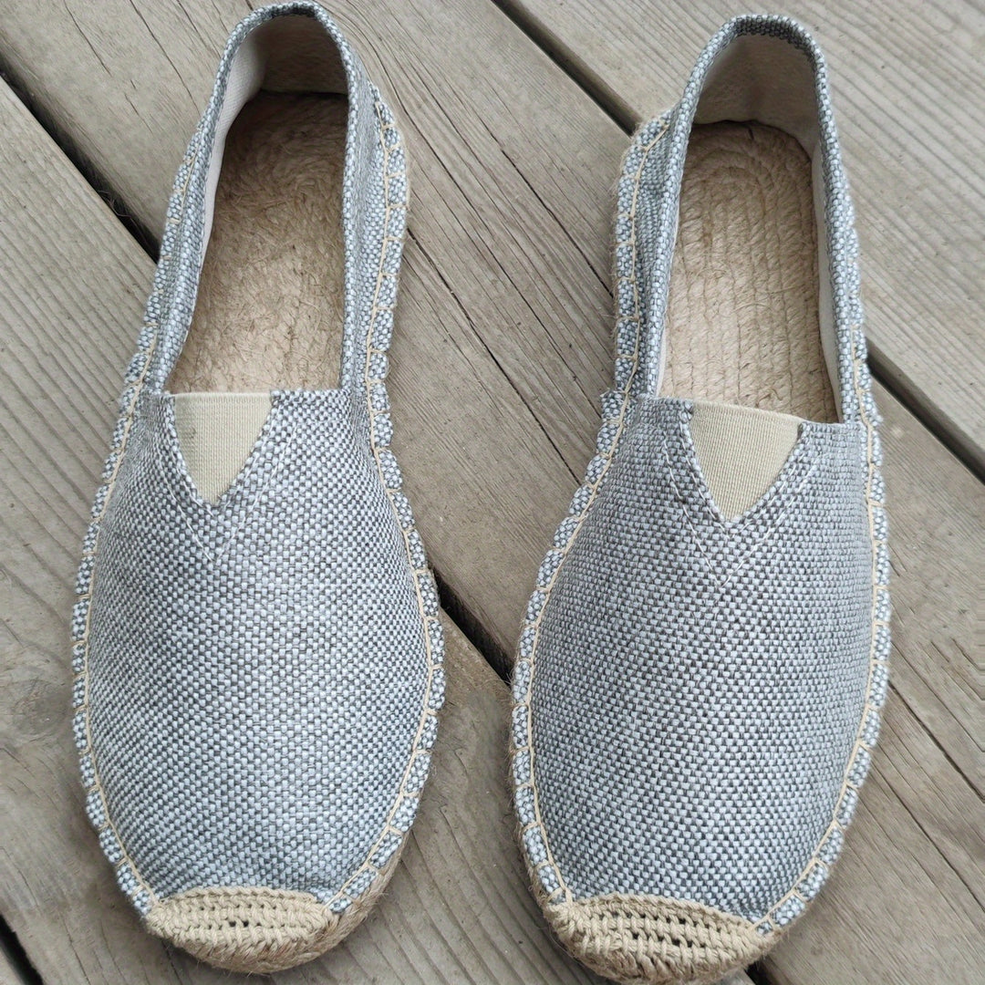 Grey espadrille slip-on shoes with textured upper and braided jute sole