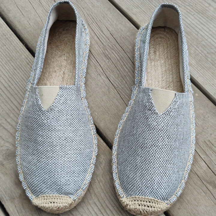 Grey espadrille slip-on shoes with textured upper and braided jute sole
