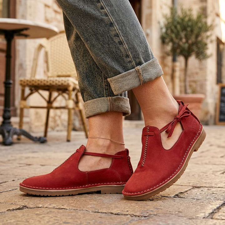 Red ComfortWalk loafers with lace-up ties and stitched moc toe
