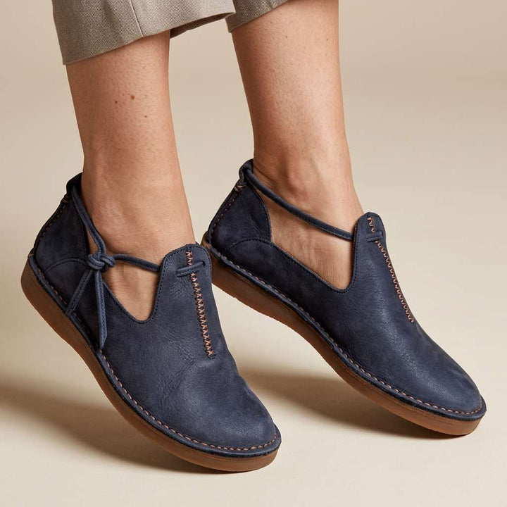 Navy ComfortWalk loafers with lace-up ties and contrast stitching