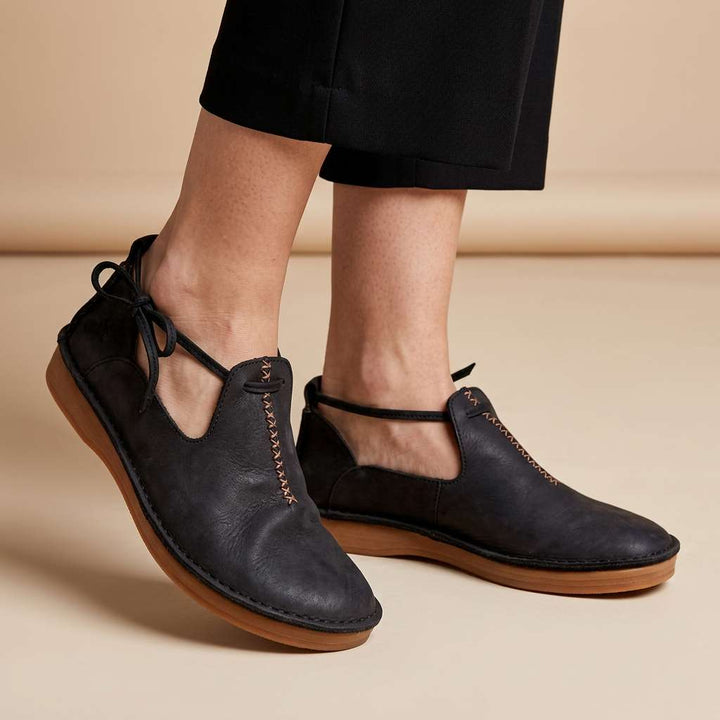 Black ComfortWalk loafers with lace-up ties and stitched trim