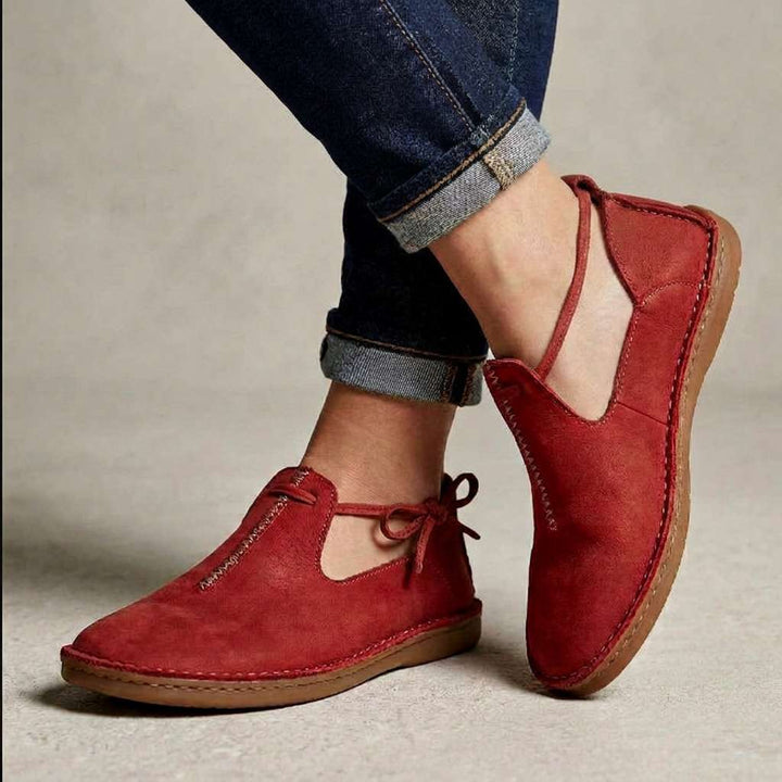 Red ComfortWalk loafers with lace-up ties and suede-like uppers
