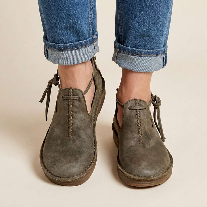 Gray ComfortWalk loafers with lace-up ties and vertical stitch detail